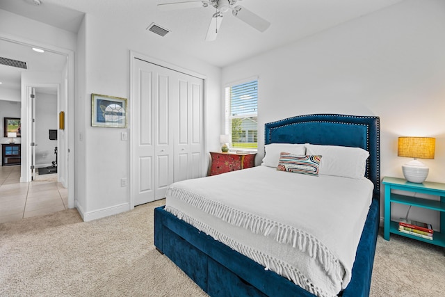 2611 Ballydoyle Ln, Melbourne, FL 32940 - tiled bedroom with carpet flooring, a closet, baseboards, and ceiling fan