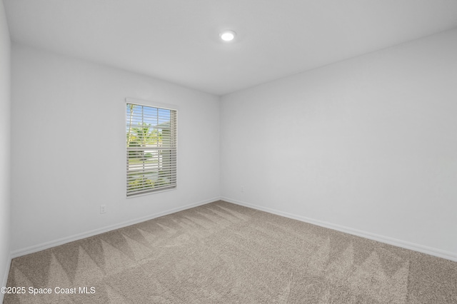 1170 Pluto St SE, Palm Bay, FL 32909 - carpeted empty room featuring baseboards