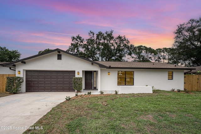 1521 Baker St NE, Palm Bay, FL 32907 - view of front of home featuring a garage, concrete driveway, and stucco siding