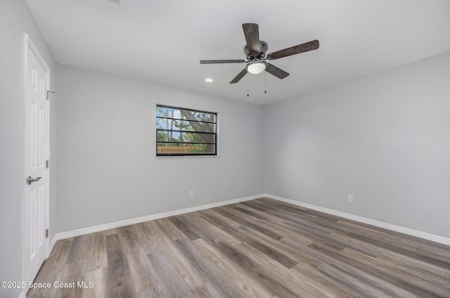 1521 Baker St NE, Palm Bay, FL 32907 - empty room with wood finished floors, baseboards, ceiling fan, and recessed lighting
