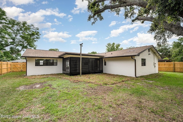 1521 Baker St NE, Palm Bay, FL 32907 - rear view of house with a sunroom and stucco siding