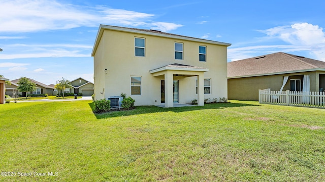 422 Moray Dr SW, Palm Bay, FL 32908 - rear view of property featuring stucco siding and central air condition unit