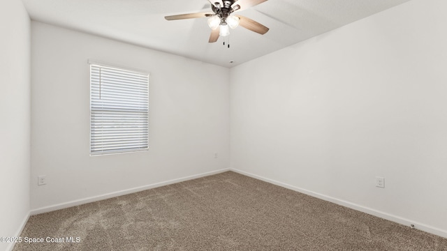 422 Moray Dr SW, Palm Bay, FL 32908 - spare room with carpet floors, baseboards, and a ceiling fan