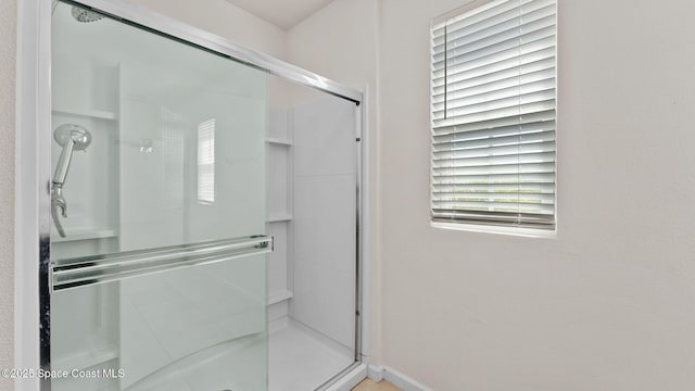 422 Moray Dr SW, Palm Bay, FL 32908 - bathroom featuring a shower stall and baseboards