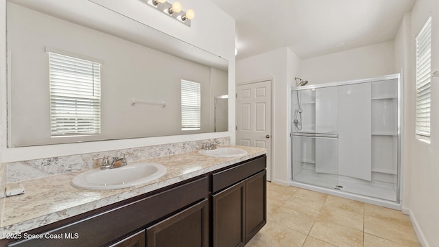 422 Moray Dr SW, Palm Bay, FL 32908 - bathroom with a stall shower, tile patterned flooring, and double vanity