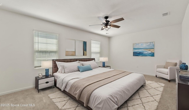422 Moray Dr SW, Palm Bay, FL 32908 - bedroom featuring light colored carpet, baseboards, and ceiling fan