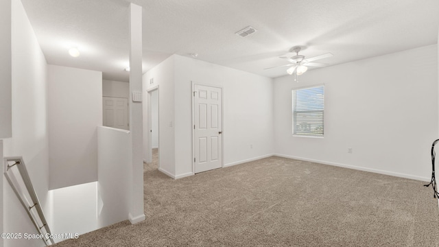 422 Moray Dr SW, Palm Bay, FL 32908 - unfurnished bedroom with carpet, baseboards, and ceiling fan