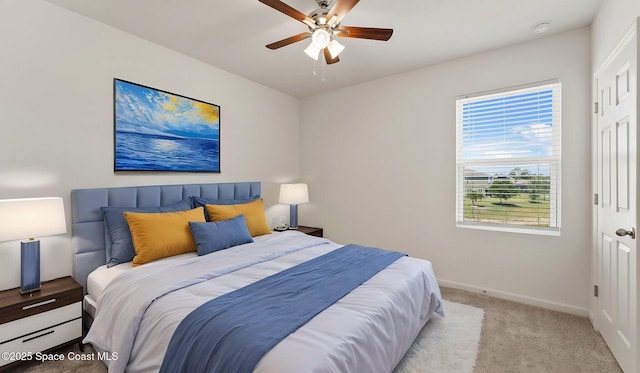 422 Moray Dr SW, Palm Bay, FL 32908 - bedroom with a baseboard radiator, carpet, baseboards, and ceiling fan
