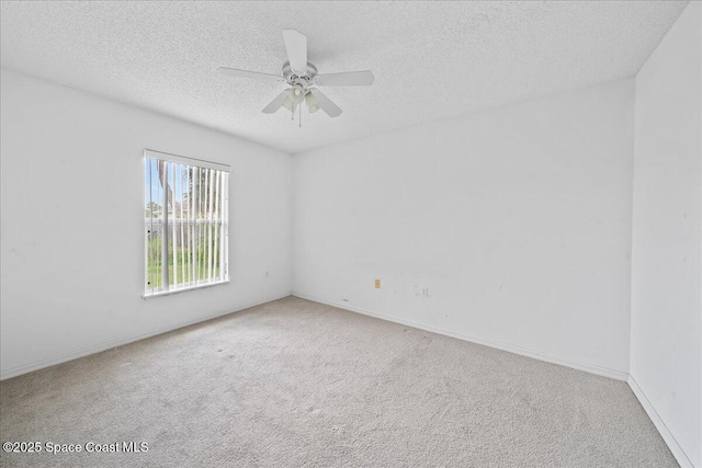 3380 Toledo Ave, Palm Bay, FL 32908 - carpeted empty room with a textured ceiling, ceiling fan, and baseboards