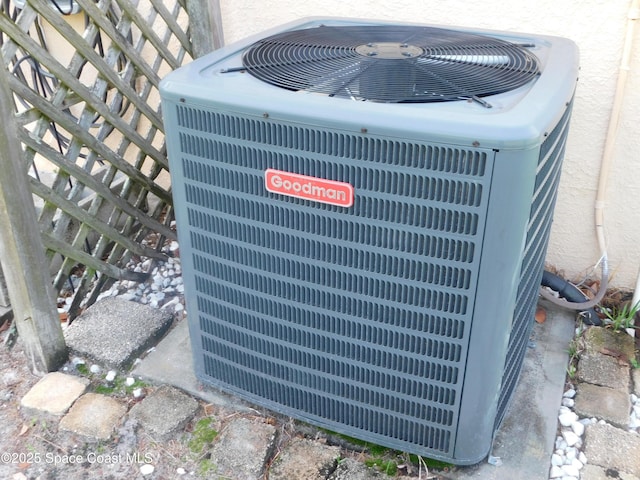 1076 Pine Creek Cir NE, Palm Bay, FL 32905 - exterior view of cooling unit and stucco siding