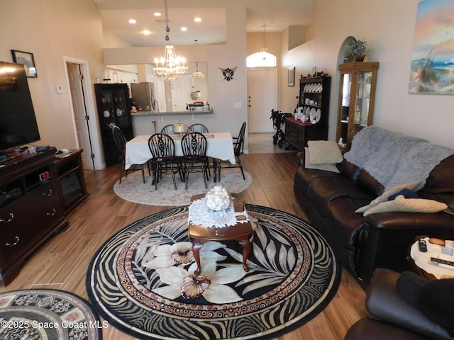 1076 Pine Creek Cir NE, Palm Bay, FL 32905 - living area featuring wood finished floors, a chandelier, and recessed lighting
