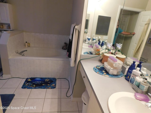 1076 Pine Creek Cir NE, Palm Bay, FL 32905 - bathroom featuring tile patterned floors, a garden tub, and vanity