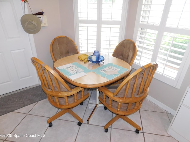 1076 Pine Creek Cir NE, Palm Bay, FL 32905 - dining area with plenty of natural light and light tile patterned floors