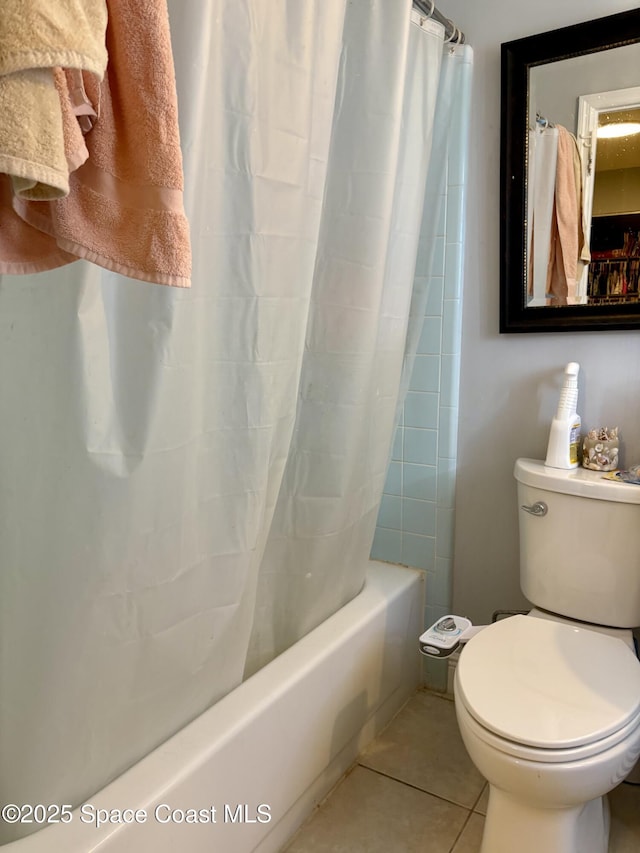 322 Ixora Ave NW, Palm Bay, FL 32907 - full bathroom featuring shower / bath combo, toilet, and tile patterned floors