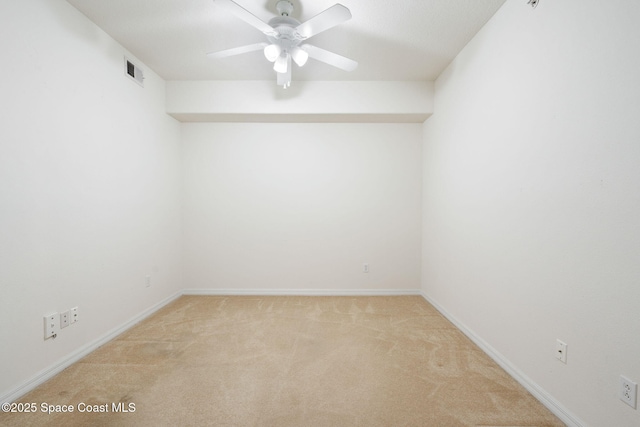 6848 Toland Dr Unit 208, Melbourne, FL 32940 - spare room featuring light colored carpet, a ceiling fan, and baseboards