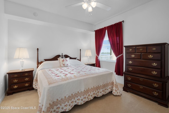 6848 Toland Dr Unit 208, Melbourne, FL 32940 - bedroom with light carpet, baseboards, and a ceiling fan