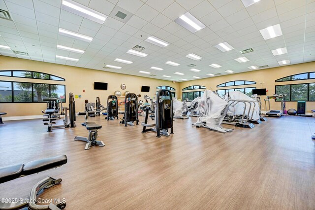 6848 Toland Dr Unit 208, Melbourne, FL 32940 - gym featuring a drop ceiling and wood finished floors