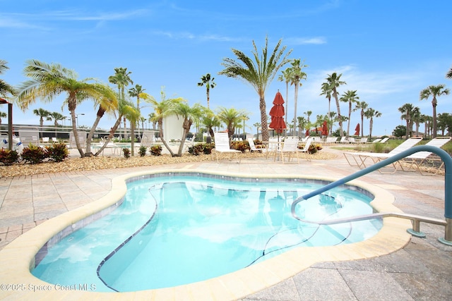 6848 Toland Dr Unit 208, Melbourne, FL 32940 - community pool with a patio and a hot tub