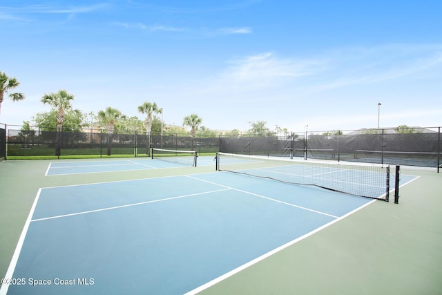 6848 Toland Dr Unit 208, Melbourne, FL 32940 - view of tennis court with community basketball court