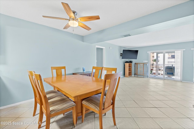 1700 N Atlantic Ave Unit 133, Cocoa Beach, FL 32931 - dining area with light tile patterned floors and ceiling fan