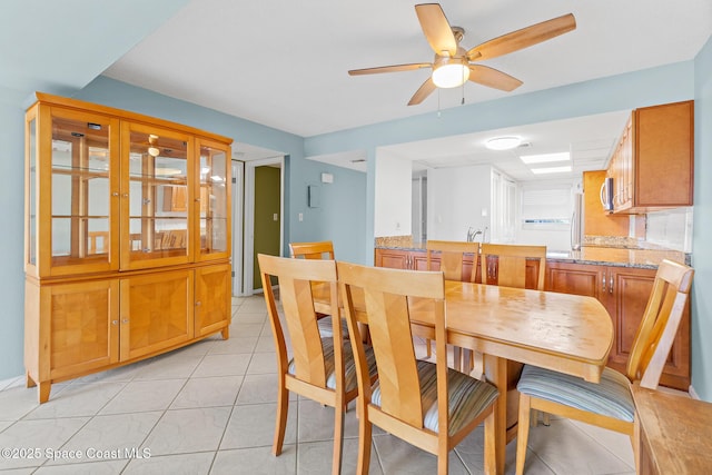 1700 N Atlantic Ave Unit 133, Cocoa Beach, FL 32931 - dining space featuring ceiling fan and light tile patterned floors