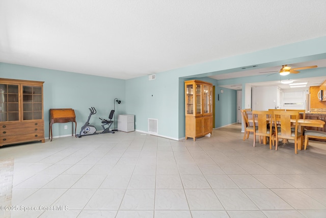 1700 N Atlantic Ave Unit 133, Cocoa Beach, FL 32931 - dining space featuring a ceiling fan and light tile patterned flooring