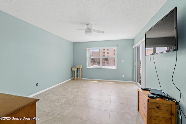 1700 N Atlantic Ave Unit 133, Cocoa Beach, FL 32931 - unfurnished bedroom with a textured ceiling and a ceiling fan