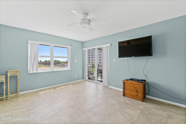 1700 N Atlantic Ave Unit 133, Cocoa Beach, FL 32931 - unfurnished living room with ceiling fan and a textured ceiling