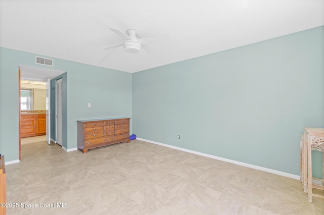 1700 N Atlantic Ave Unit 133, Cocoa Beach, FL 32931 - unfurnished bedroom with a ceiling fan and a closet