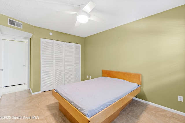 1700 N Atlantic Ave Unit 133, Cocoa Beach, FL 32931 - bedroom with a closet, light tile patterned flooring, and ceiling fan