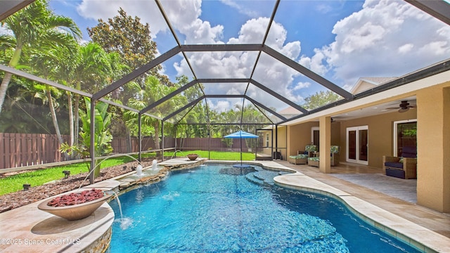 3266 Helmsdale Ct, Melbourne, FL 32940 - view of swimming pool with a fenced backyard, a patio, a ceiling fan, and a lanai