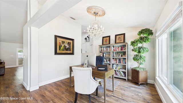 3266 Helmsdale Ct, Melbourne, FL 32940 - office area with vaulted ceiling, wood finished floors, a chandelier, and baseboards