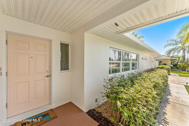 345 Dorset Dr, Cocoa Beach, FL 32931 - entrance to property featuring stucco siding