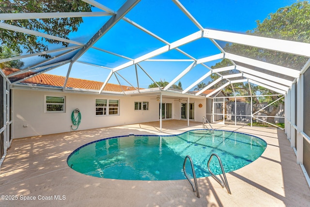 345 Dorset Dr, Cocoa Beach, FL 32931 - swimming pool with a patio, ceiling fan, and a lanai