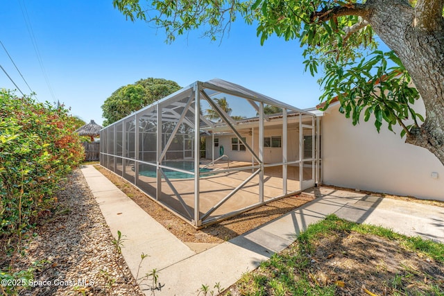 345 Dorset Dr, Cocoa Beach, FL 32931 - view of swimming pool with a patio area and glass enclosure
