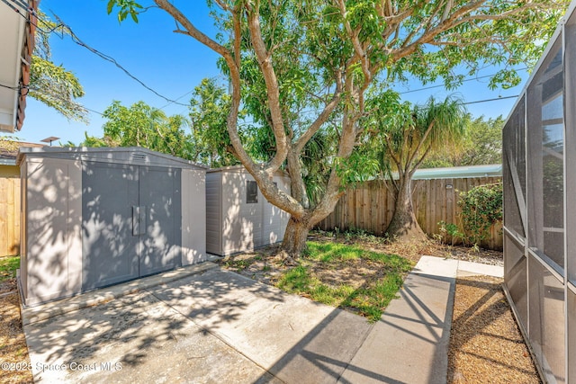 345 Dorset Dr, Cocoa Beach, FL 32931 - fenced backyard with a patio area