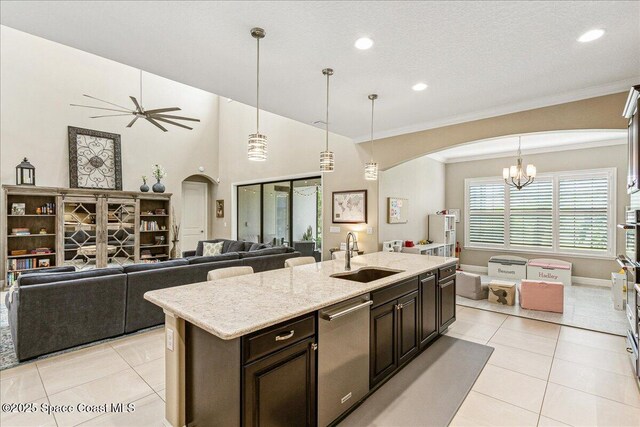 2228 Zuma Ln, Melbourne, FL 32940 - kitchen featuring dishwasher, open floor plan, arched walkways, recessed lighting, and ornamental molding