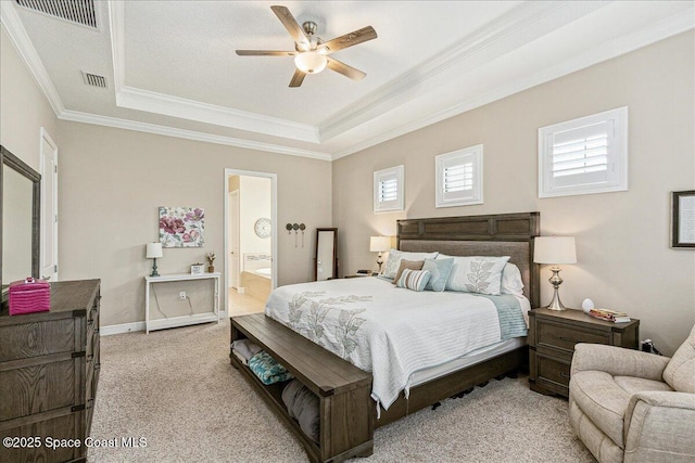 2228 Zuma Ln, Melbourne, FL 32940 - carpeted bedroom with a raised ceiling, crown molding, connected bathroom, and a ceiling fan