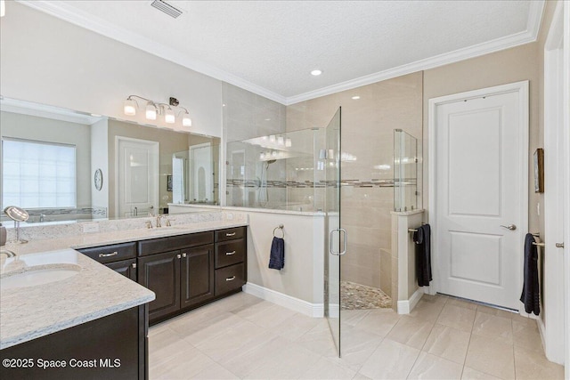 2228 Zuma Ln, Melbourne, FL 32940 - bathroom featuring two vanities, a stall shower, ornamental molding, a tub, and a textured ceiling