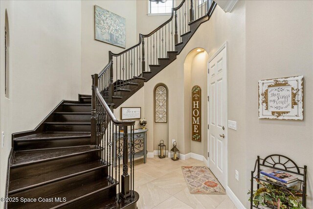 2228 Zuma Ln, Melbourne, FL 32940 - foyer entrance with stairway and a high ceiling