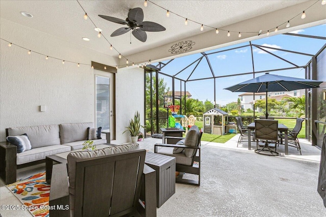 2228 Zuma Ln, Melbourne, FL 32940 - view of patio / terrace with an outdoor hangout area, outdoor dining area, glass enclosure, and a ceiling fan