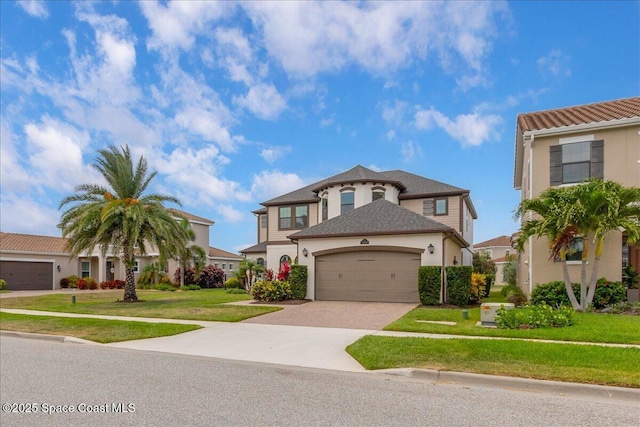 2228 Zuma Ln, Melbourne, FL 32940 - view of front facade featuring stucco siding, driveway, a garage, and a front lawn