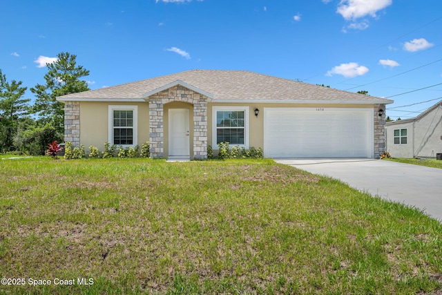 1650 Wyoming Dr SE, Palm Bay, FL 32909 - single story home featuring an attached garage, stone siding, concrete driveway, a front yard, and stucco siding