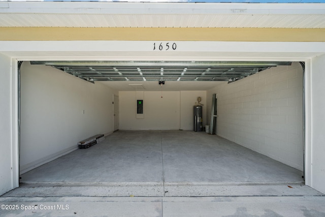 1650 Wyoming Dr SE, Palm Bay, FL 32909 - garage featuring water heater, electric panel, and concrete block wall