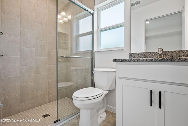 1650 Wyoming Dr SE, Palm Bay, FL 32909 - full bath featuring toilet, a shower stall, and vanity
