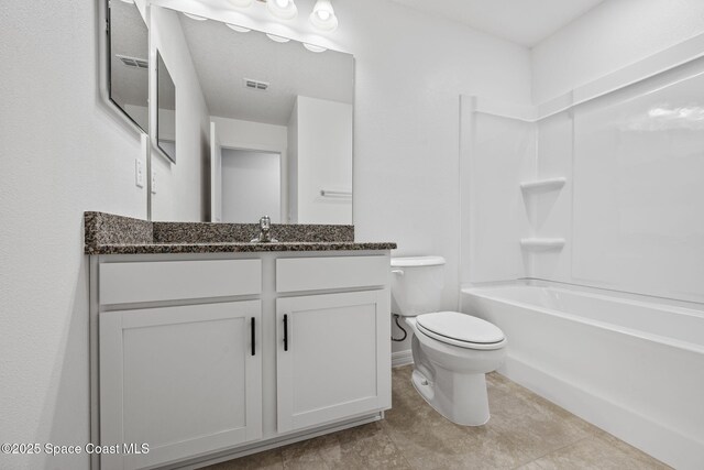 1650 Wyoming Dr SE, Palm Bay, FL 32909 - full bath featuring toilet, vanity, shower / tub combination, and tile patterned floors