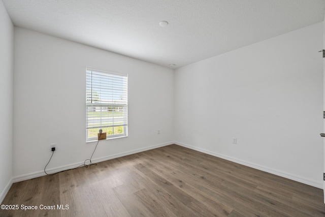 1650 Wyoming Dr SE, Palm Bay, FL 32909 - unfurnished room featuring wood finished floors and baseboards