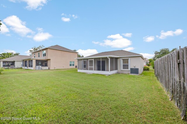 2268 Spring Creek Cir, Palm Bay, FL 32905 - back of property featuring a sunroom, central AC unit, and stucco siding