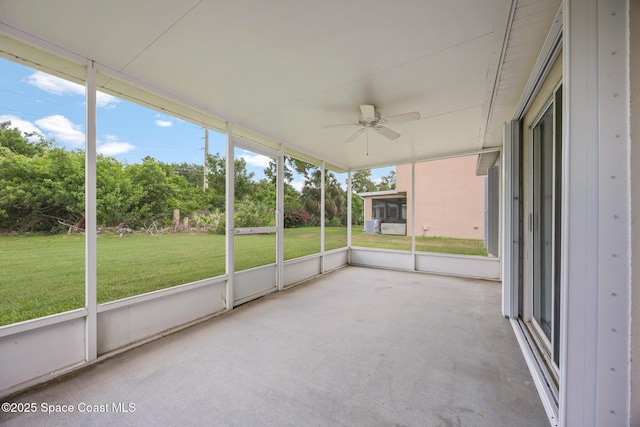 2268 Spring Creek Cir, Palm Bay, FL 32905 - unfurnished sunroom with a ceiling fan and view of wooded area