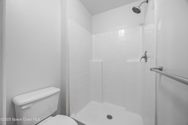 2268 Spring Creek Cir, Palm Bay, FL 32905 - bathroom featuring a stall shower and toilet